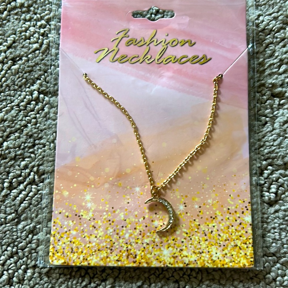 Gold Necklace with a diamond moon